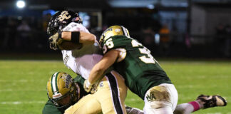 
			
				                                Wyoming Area’s Kevin Wiedl (4) and Matthew Rutkoski (35) tackle Southern Columbia’s Kyle Christman for a loss. 
                                 Tony Callaio | For Times Leader

			
		
