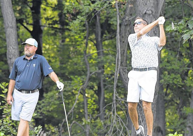 
			
				                                David Kluger tees off on the seventh hole at Fox Hill Country Club with his partner Eric Williams looking on. The team of Kluger/Williams defeated Bobby Santarelli/John Barone for the John A. Allan Tournament last Sunday.
 
			
		