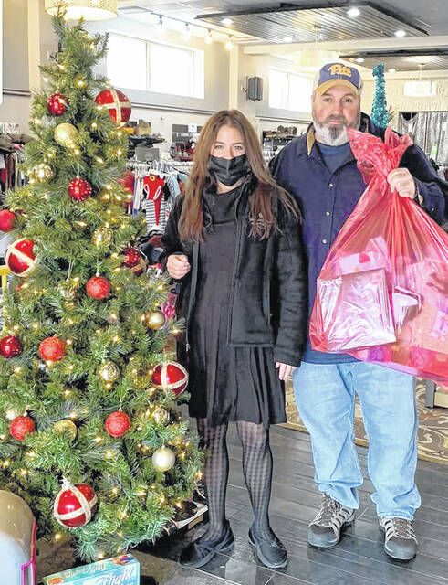 <p>Dawn Randazzo of Compassionate Care Hospice picks up an Angel Tree Christmas donation from Greater Pittston Santa Squad founder, Anthony Marranca.</p>
                                 <p>Submitted photo</p>