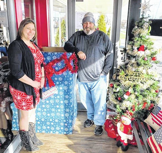 <p>Anthony Marranca, founder of the Greater Pittston Santa Squad, stands beside Trista Cruz, co-owner of American Grill and BBQ Restaurant, Exeter, where the Santa Squad had a toy drop off box.</p>
                                 <p>Submitted photo</p>